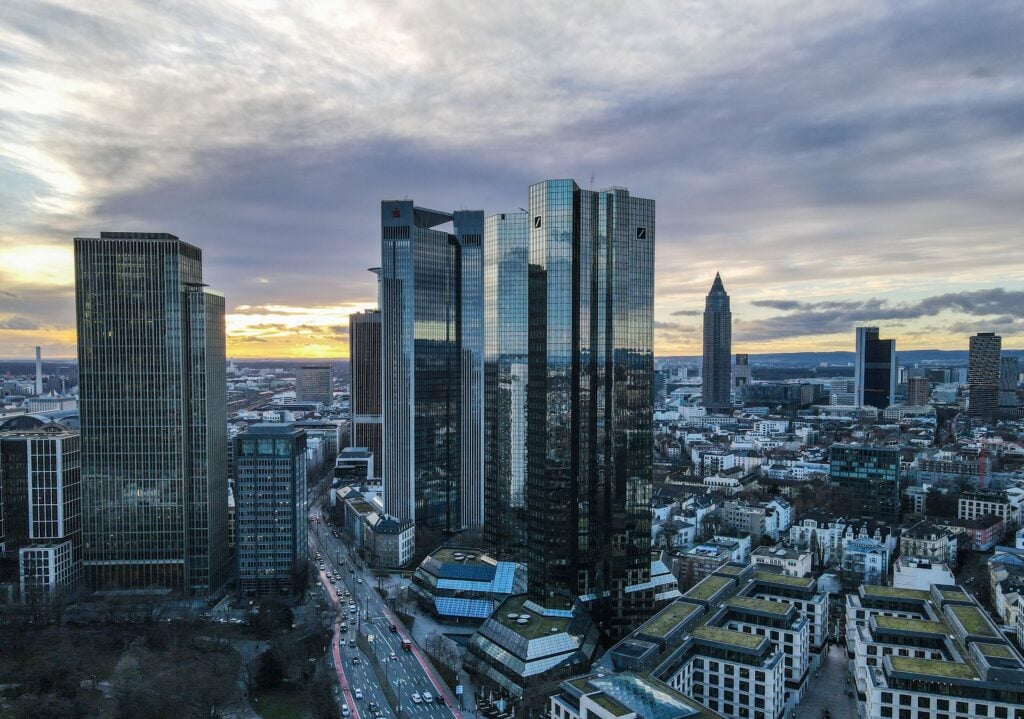 Aerial view of Frankfurt's financial district skyscrapers during a stunning sunset.
