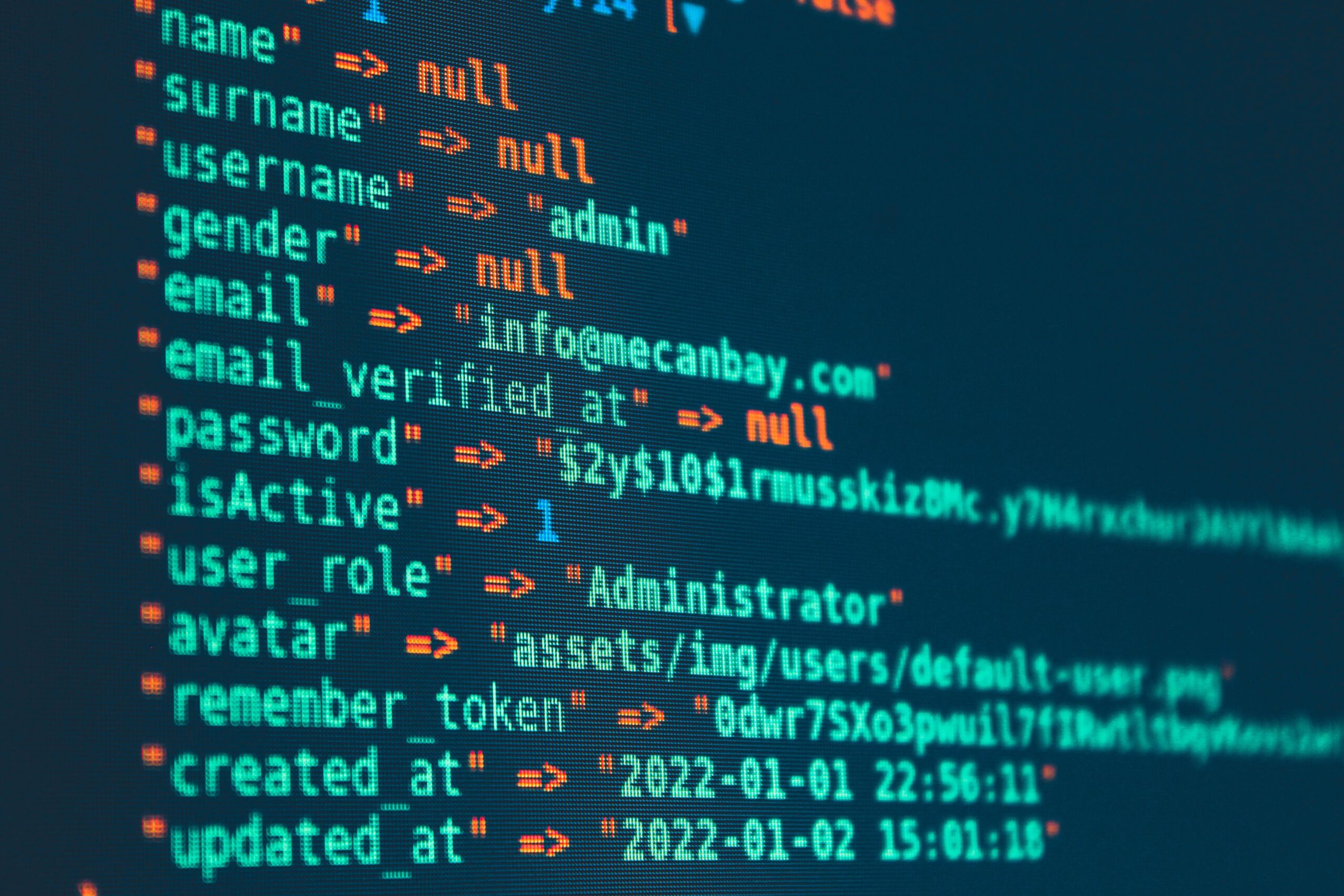Vibrant close-up of code displayed on a monitor with various programming details.