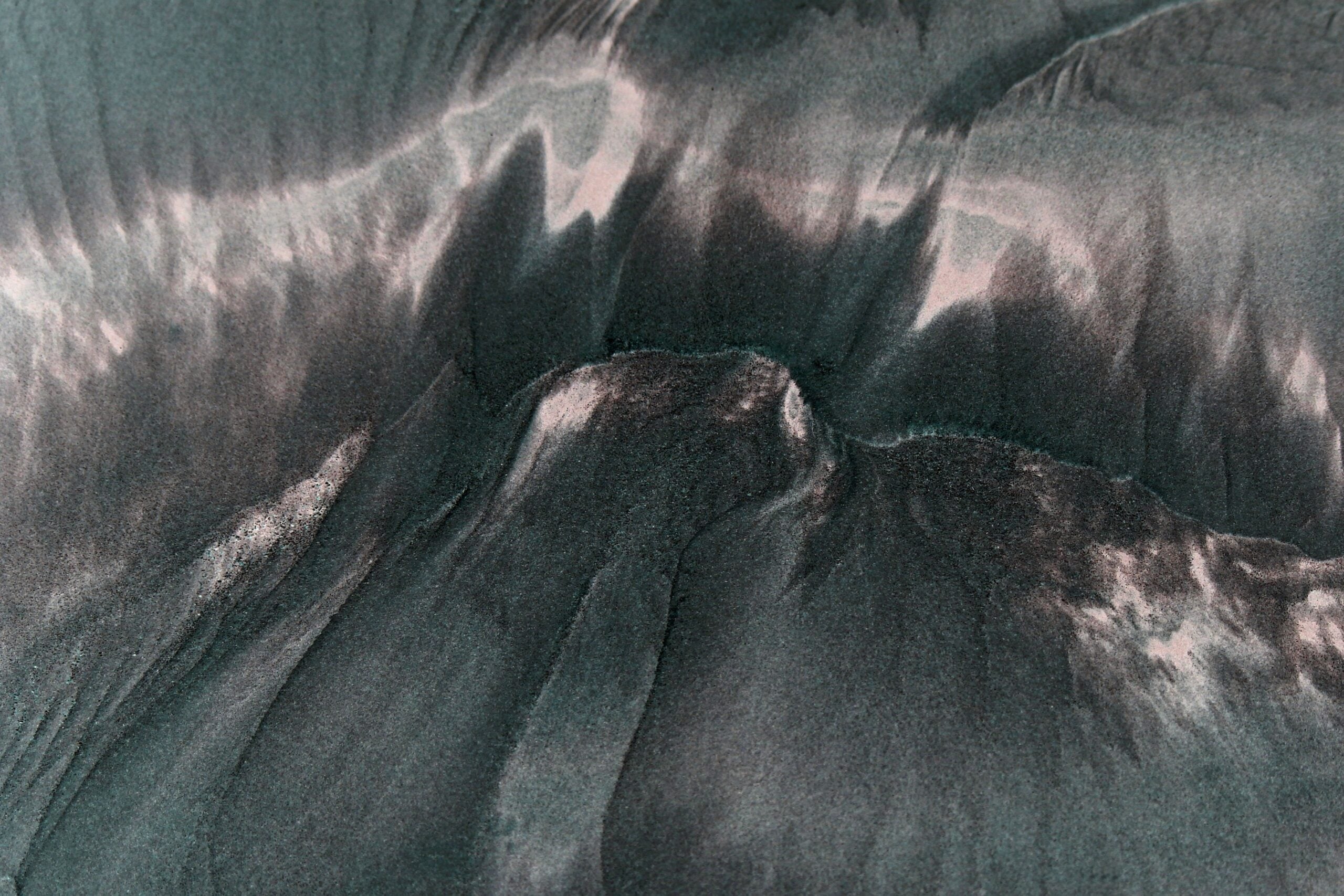 Abstract aerial view of dynamic sand patterns on Guaratuba Beach, Brazil.