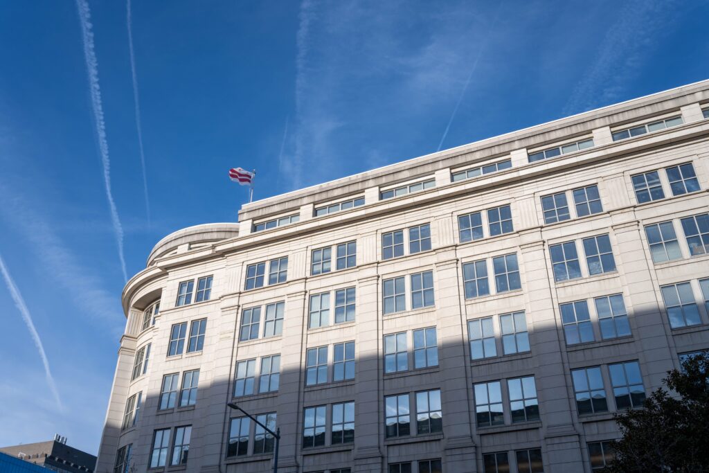 Elegant office building under a clear blue sky in Washington, D.C.