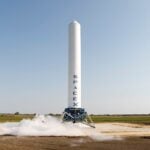 A SpaceX rocket prepares for launch in a rural landscape, capturing a sense of technological advancement.